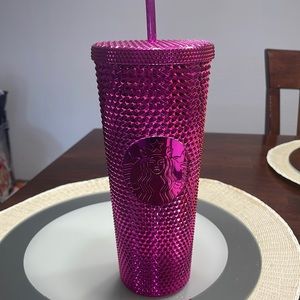 Fuchsia pink 24 oz Starbucks cup